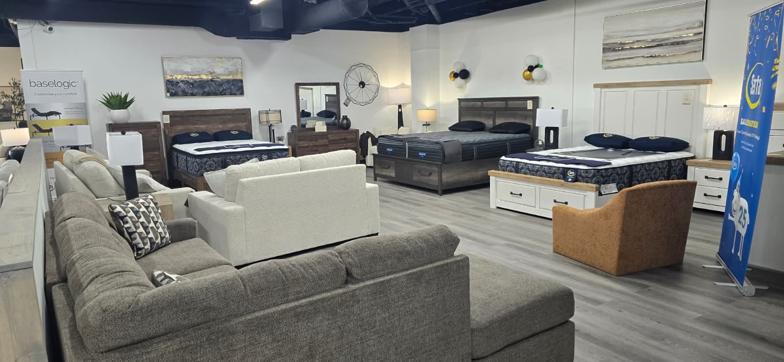 Mattresses, bedroom sets, and sofas on display in the Rockwell Home showroom